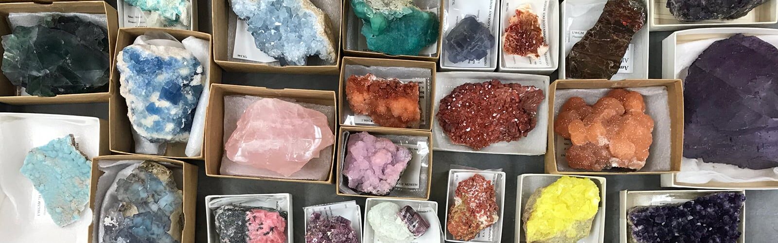 Numerous categorized, colorful gems and minerals.